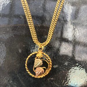 gold necklace multi tone 2 leaf w/ grape circle